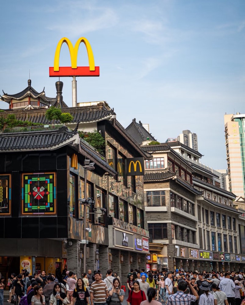 Dongmen Old Street — tiled arcade shops and crowds on the pedestrian street
