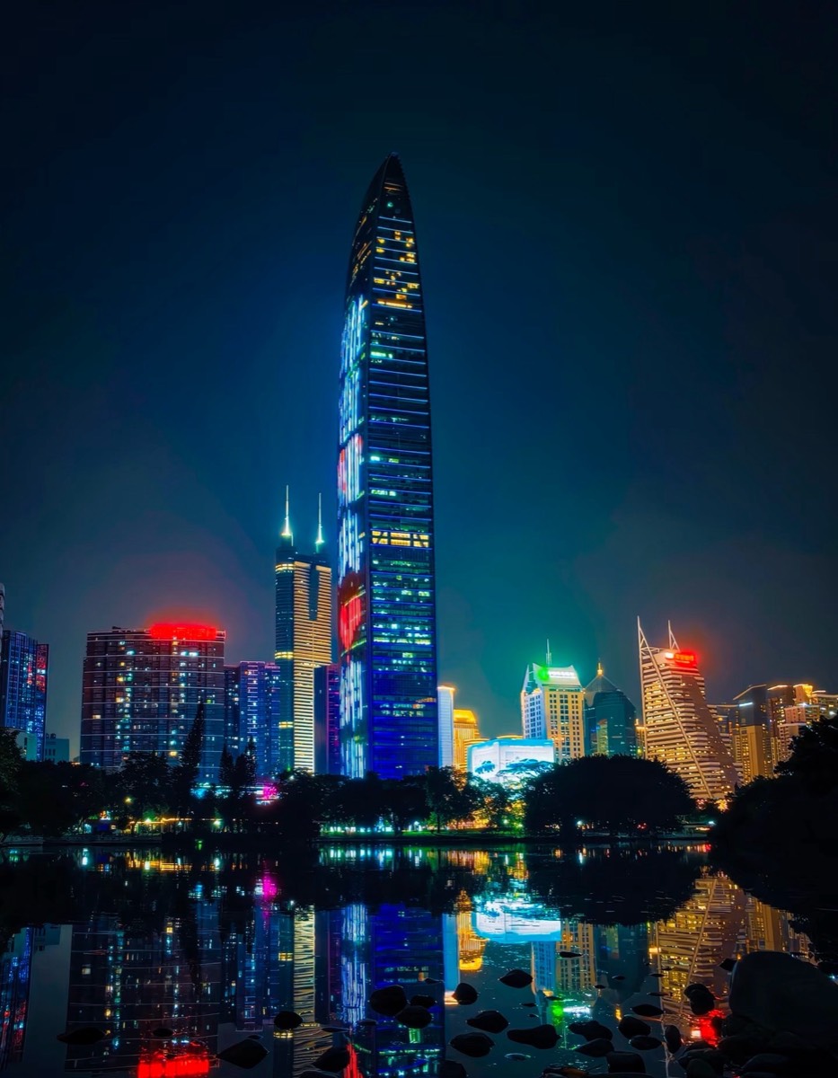 KK100 (Kingkey 100) tower at night, reflected in the lake at Lizhi Park