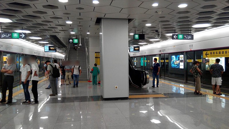 Shenzhen Metro Line 11 Airport Station platform with screen doors and train