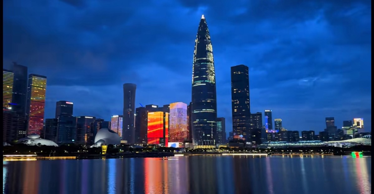 Talent Park at night — the Houhai skyline mirrored in the lake
